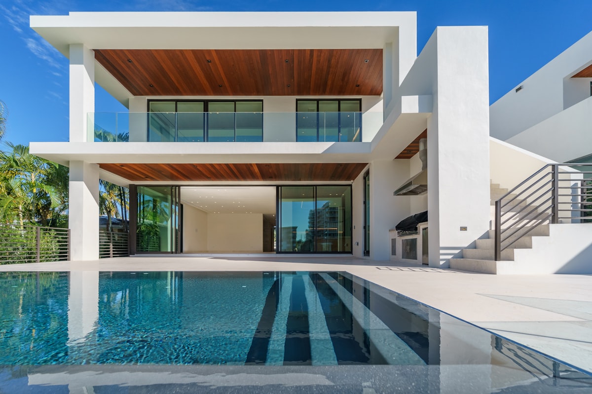 Modern glass villa with infinity pool overlooking the sea